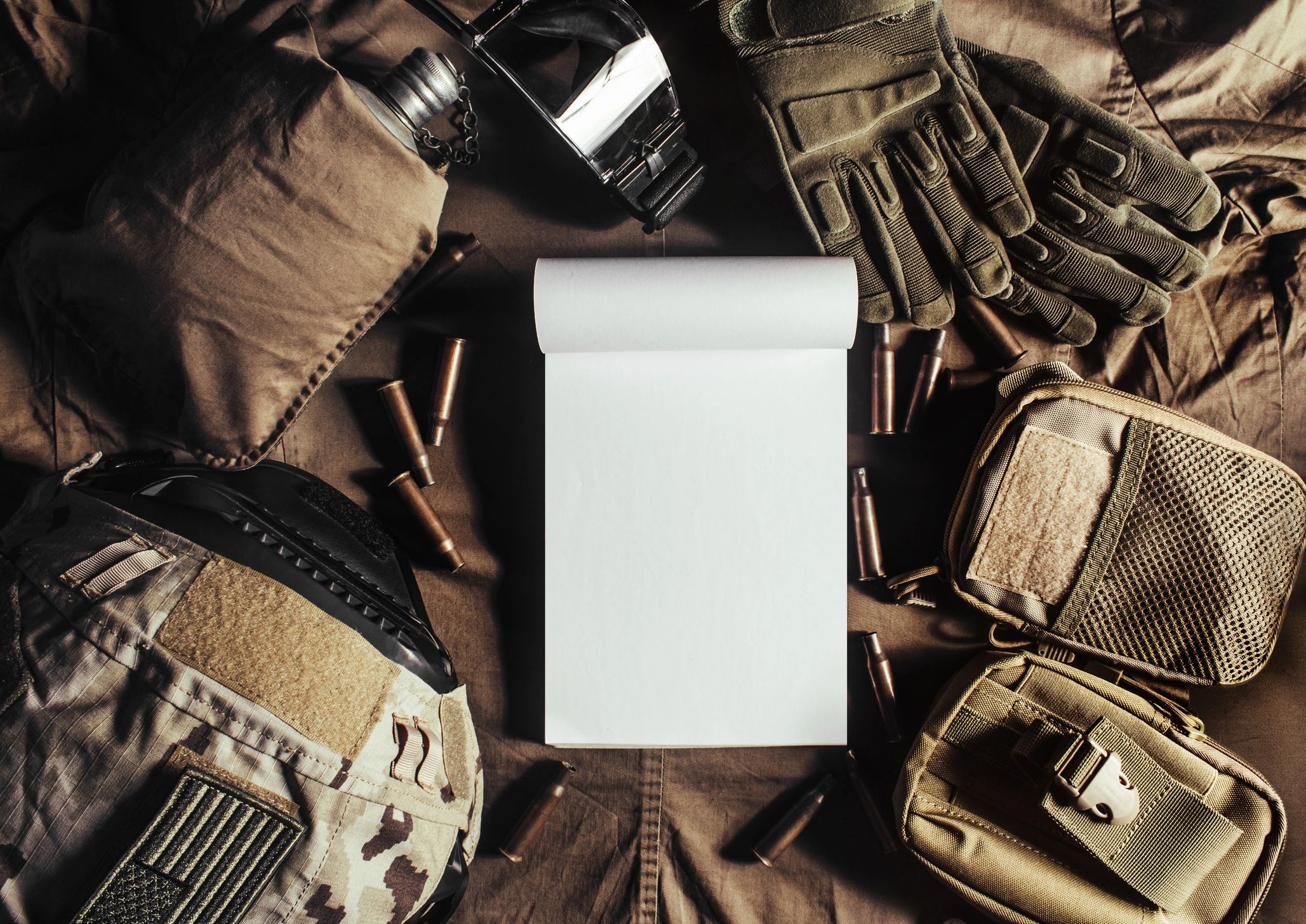 Tactical helmet gloves and field gear on a table