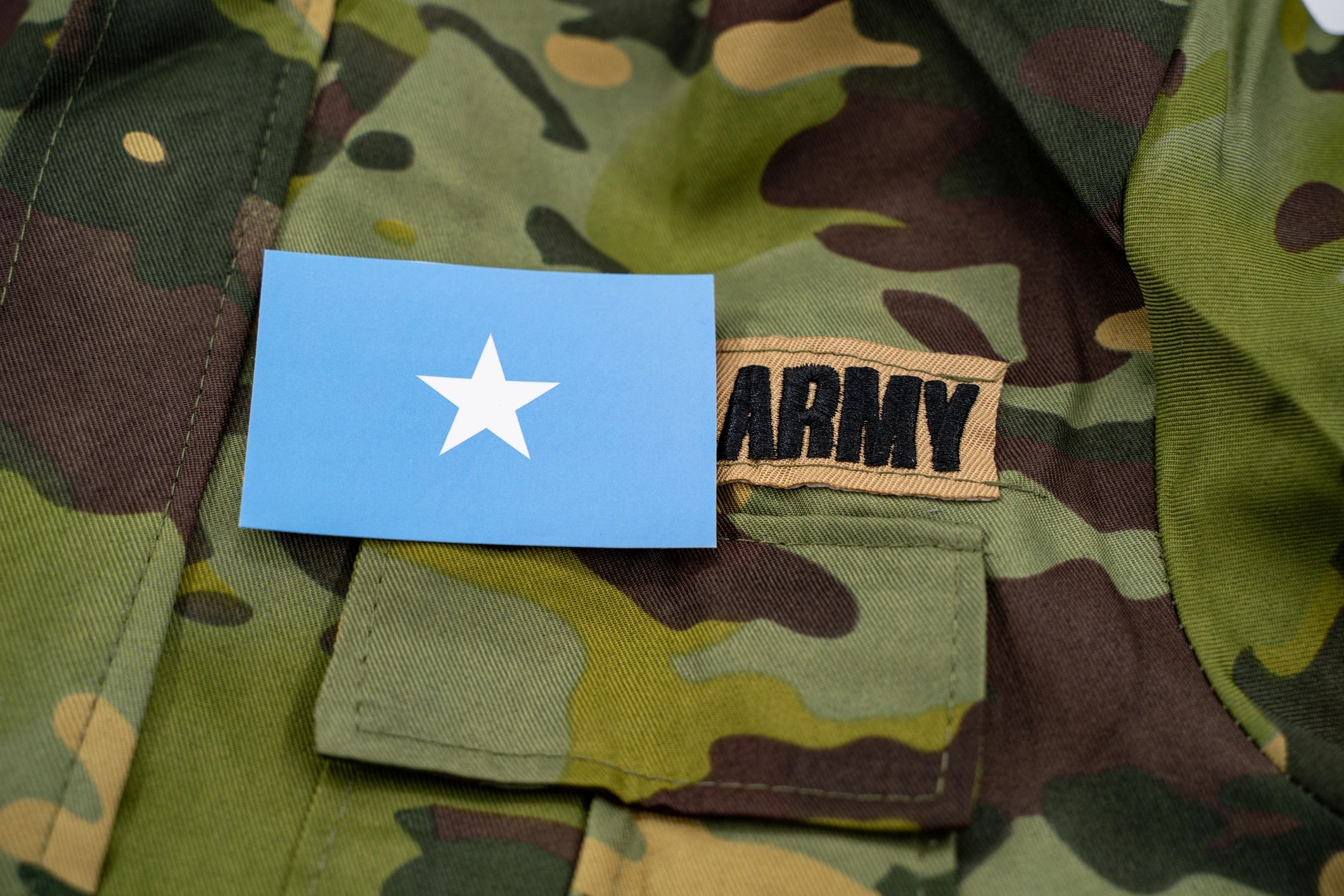 Close-up of tactical-style gear and uniform details
